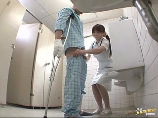 Horny Japanese nurse gives a handjob to chum around with annoy patient