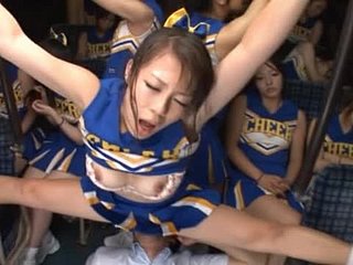 Strange Japanese cheerleaders get it overhead on a omnibus